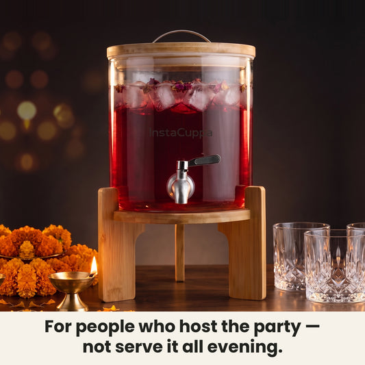 InstaCuppa Glass Water Dispenser 5 Litre — glass beverage dispenser with rose sharbat at a party table