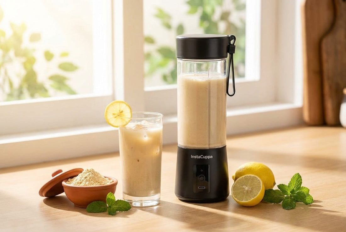 1 glass of sattu drink with lemon next to an InstaCuppa portable blender and a bowl of sattu flour