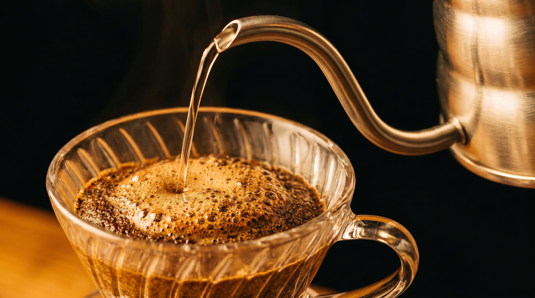 Close-up of thin water stream from gooseneck kettle during slow pour coffee brewing