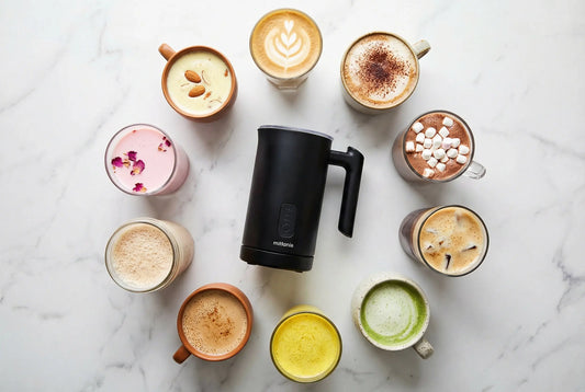 10 beverages made with milk frother arranged around electric frother