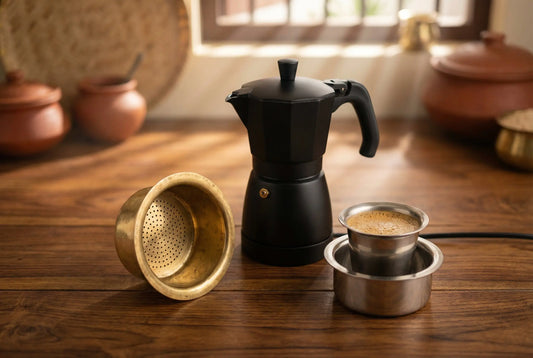 South Indian brass coffee filter next to modern electric moka pot