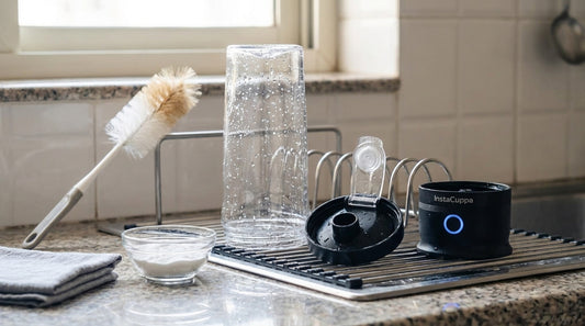 How to clean a protein shaker: a washed InstaCuppa electric protein shaker taken apart and air-drying on a dish rack next to a bottle brush and a bowl of baking soda - InstaCuppa