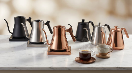 Six gooseneck kettles lined up for comparison