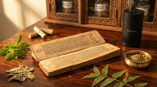 Ayurvedic palm-leaf manuscript with tulsi neem sandalwood and InstaCuppa aroma diffuser