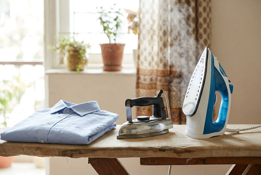 Dry iron vs steam iron compared side by side on an ironing board with a folded cotton shirt in an Indian home