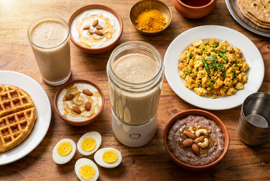 High protein Indian breakfast spread with protein smoothie, egg bhurji, boiled eggs, ragi porridge, waffle, and Greek yogurt