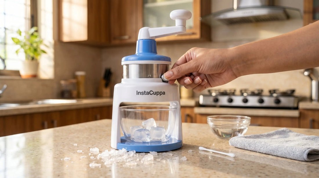 InstaCuppa Manual Ice Shaver troubleshooting — hand adjusting blade with ice shavings on kitchen counter