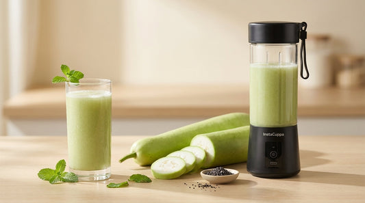InstaCuppa Portable Blender beside a glass of fresh lauki (bottle gourd) juice, a whole bottle gourd, mint and black salt