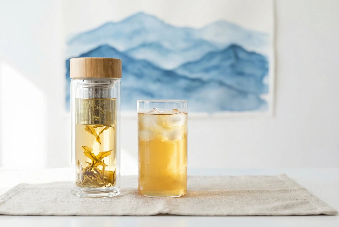 Glass tea infuser bottle with golden Nilgiri tea and iced tea glass showing clarity when chilled