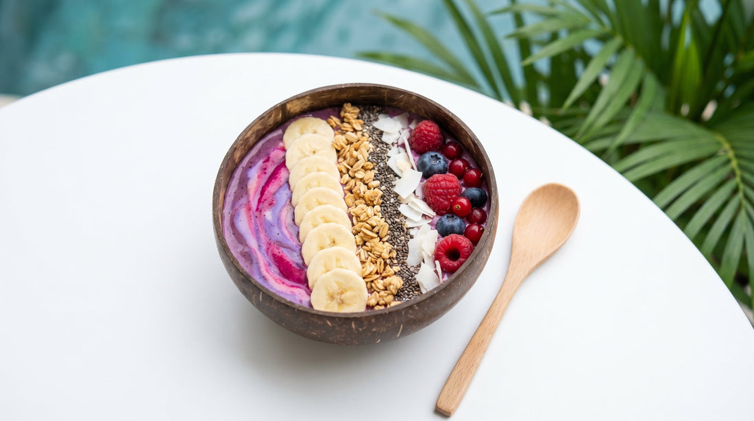 Thick smoothie bowl with fresh berries granola and chia seeds on an Indian kitchen table