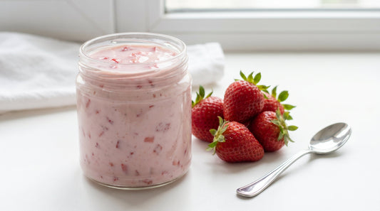 Fresh strawberry yogurt with sliced strawberries in white bowl
