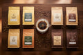 8 bags of specialty Indian coffee beans arranged for pour over brewing