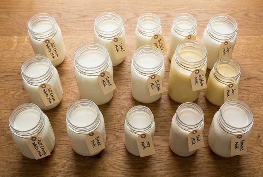 Different types of Indian milk in glass jars for frothing comparison