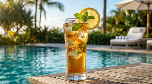 Tall glass of iced tea with ice cubes and lemon