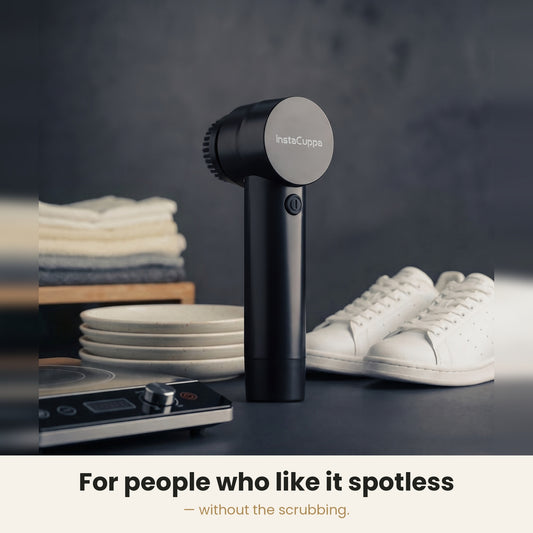 InstaCuppa Electric Cleaning Brush - spinning brush head cleaning a kitchen sink corner