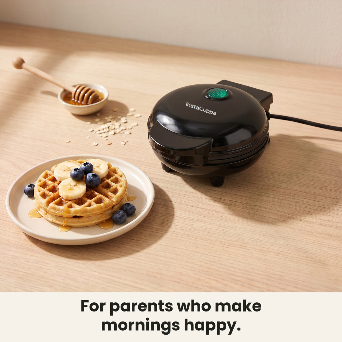 InstaCuppa Mini Waffle Maker - closed, with a plate of banana and blueberry waffles