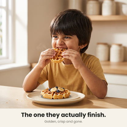 InstaCuppa Mini Waffle Maker - child eating a small 4 inch waffle