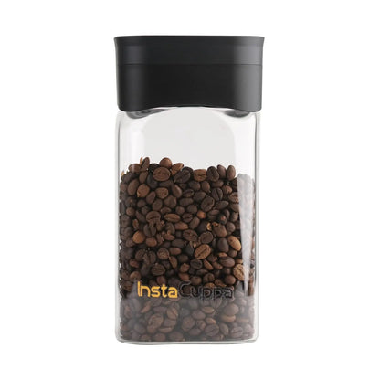 InstaCuppa airtight glass jar with vacuum lid filled with coffee beans - clear borosilicate glass with black lid