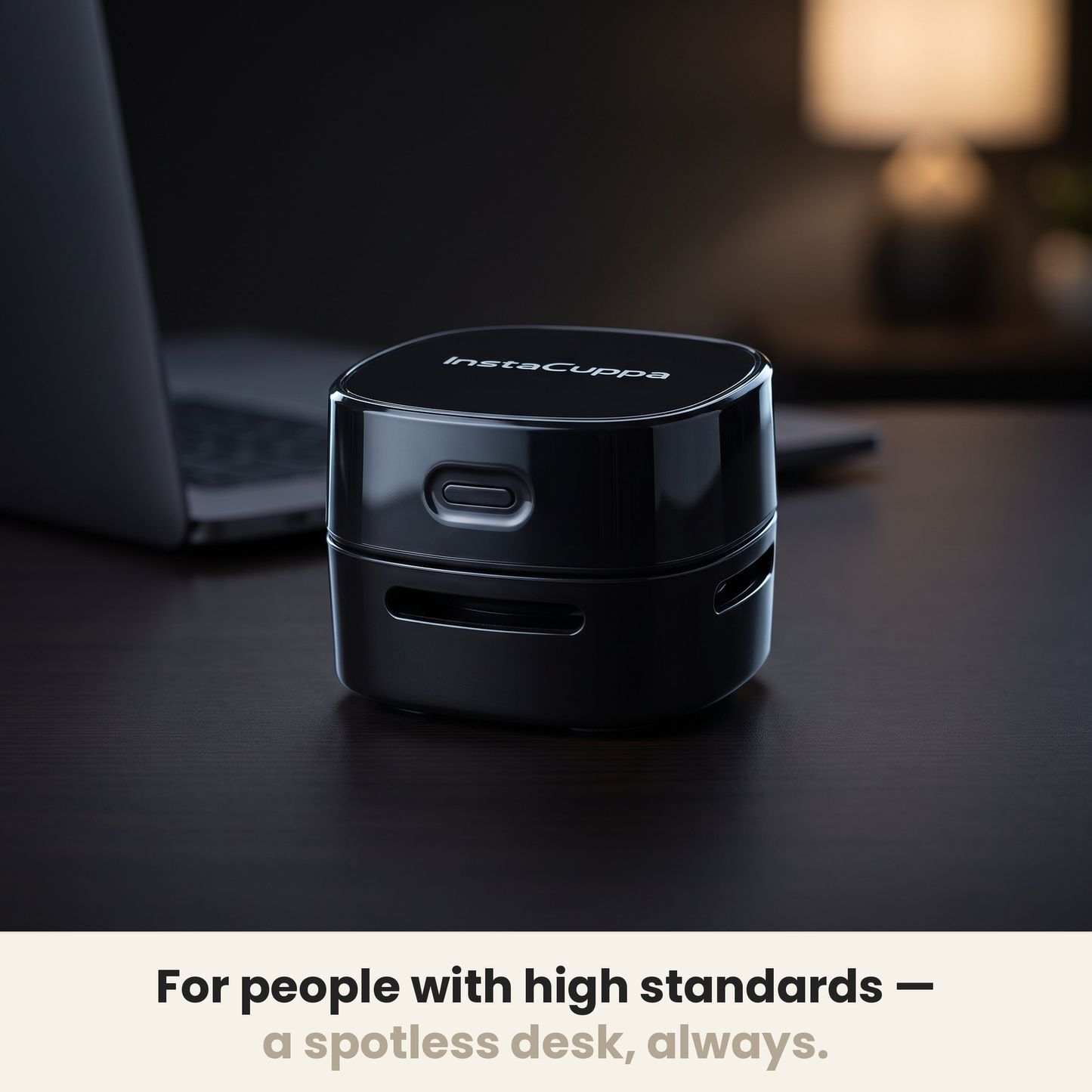 InstaCuppa desk vacuum cleaner on a spotless premium work desk in warm evening light – Rechargeable Edition