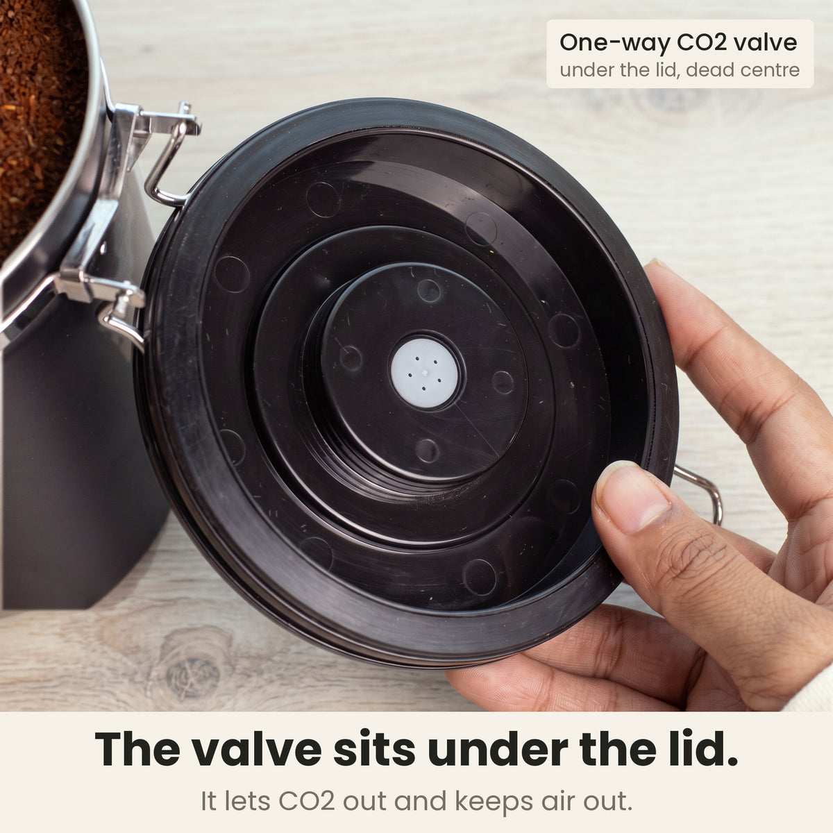 Airtight coffee container - Black - lid underside with the built-in one-way CO2 valve in the centre, lets CO2 out and keeps air out