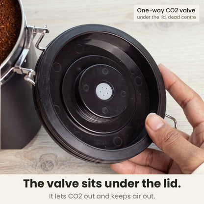 Airtight coffee container - Black - lid underside with the built-in one-way CO2 valve in the centre, lets CO2 out and keeps air out