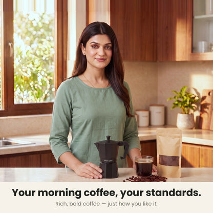 InstaCuppa Aluminium Moka Pot 300 ml - Black - your morning coffee, your standards: a woman in her kitchen with the moka pot and a glass of rich, bold coffee