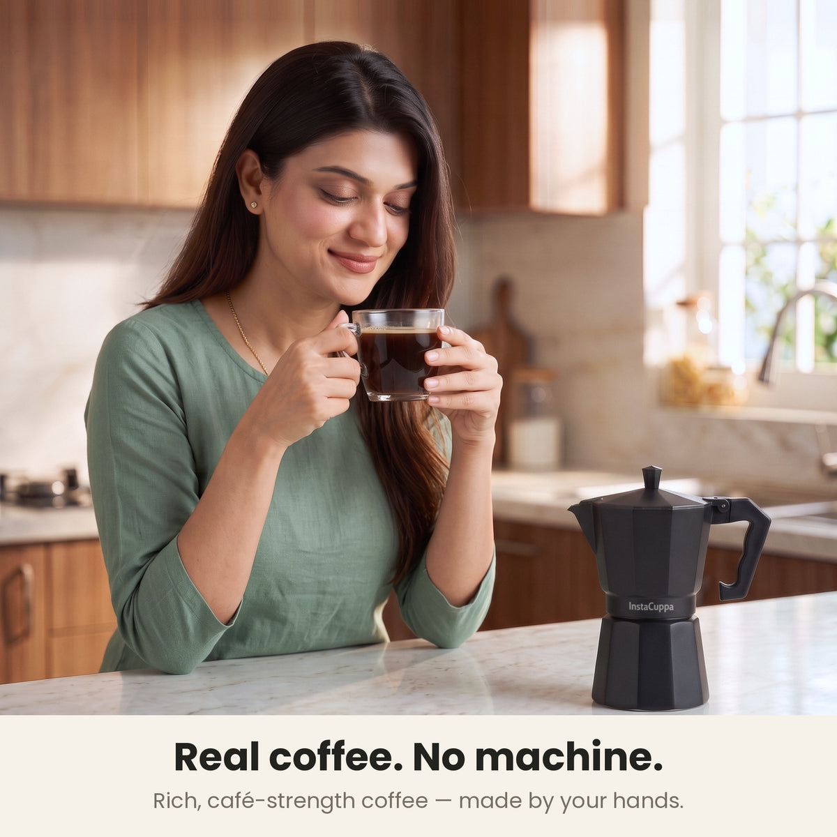 InstaCuppa Aluminium Moka Pot 300 ml - Black - real coffee, no machine: a woman sipping rich, café-strength coffee with the moka pot on the counter