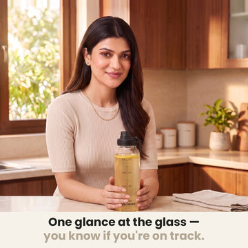 InstaCuppa Borosilicate Glass Water Bottle 1 Litre - Black - one glance at the glass and you know if you're on track: holding the bottle at the kitchen counter
