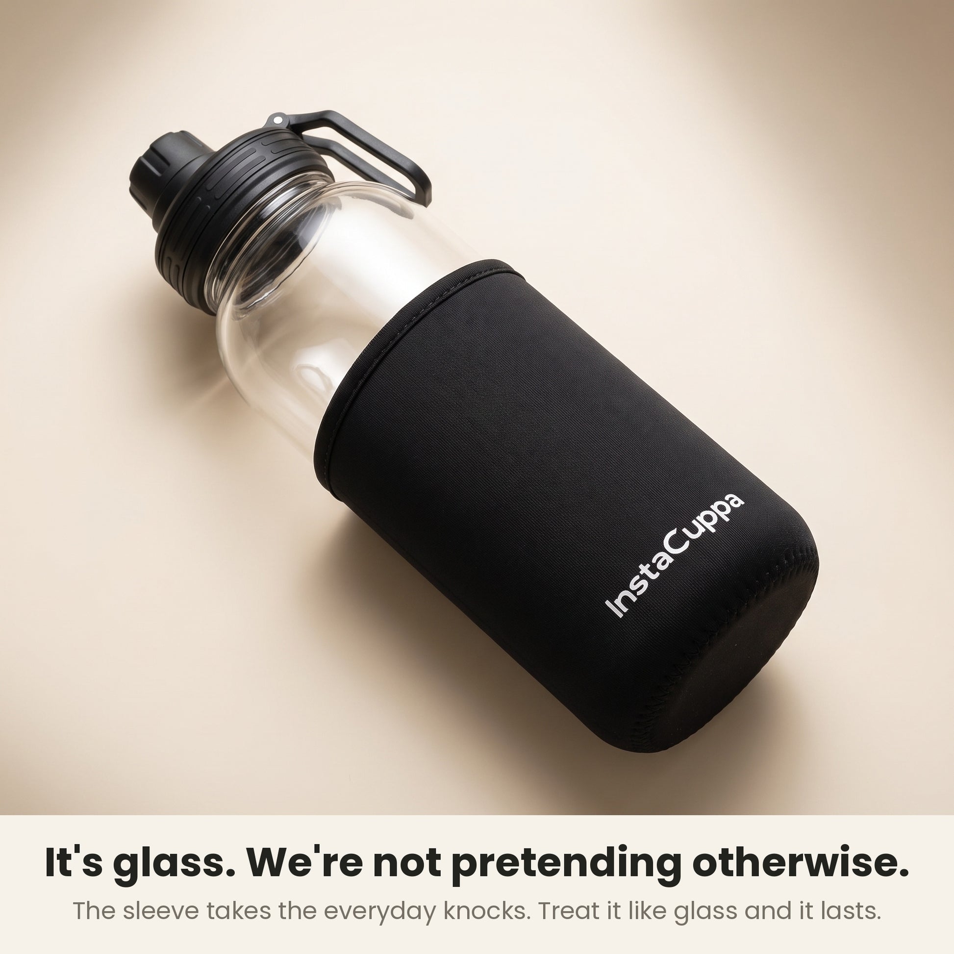 InstaCuppa Borosilicate Glass Water Bottle 1 Litre - Black - neoprene sleeve slid down to show the glass