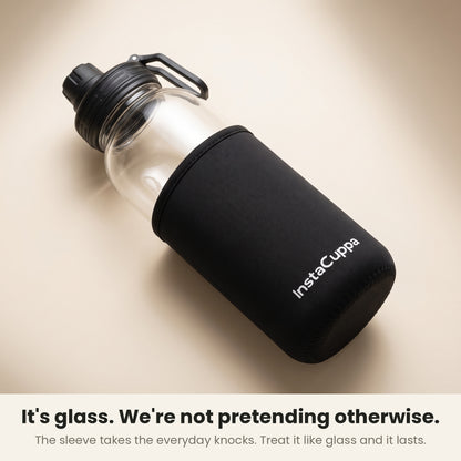 InstaCuppa Borosilicate Glass Water Bottle 1 Litre - Black - neoprene sleeve slid down to show the glass