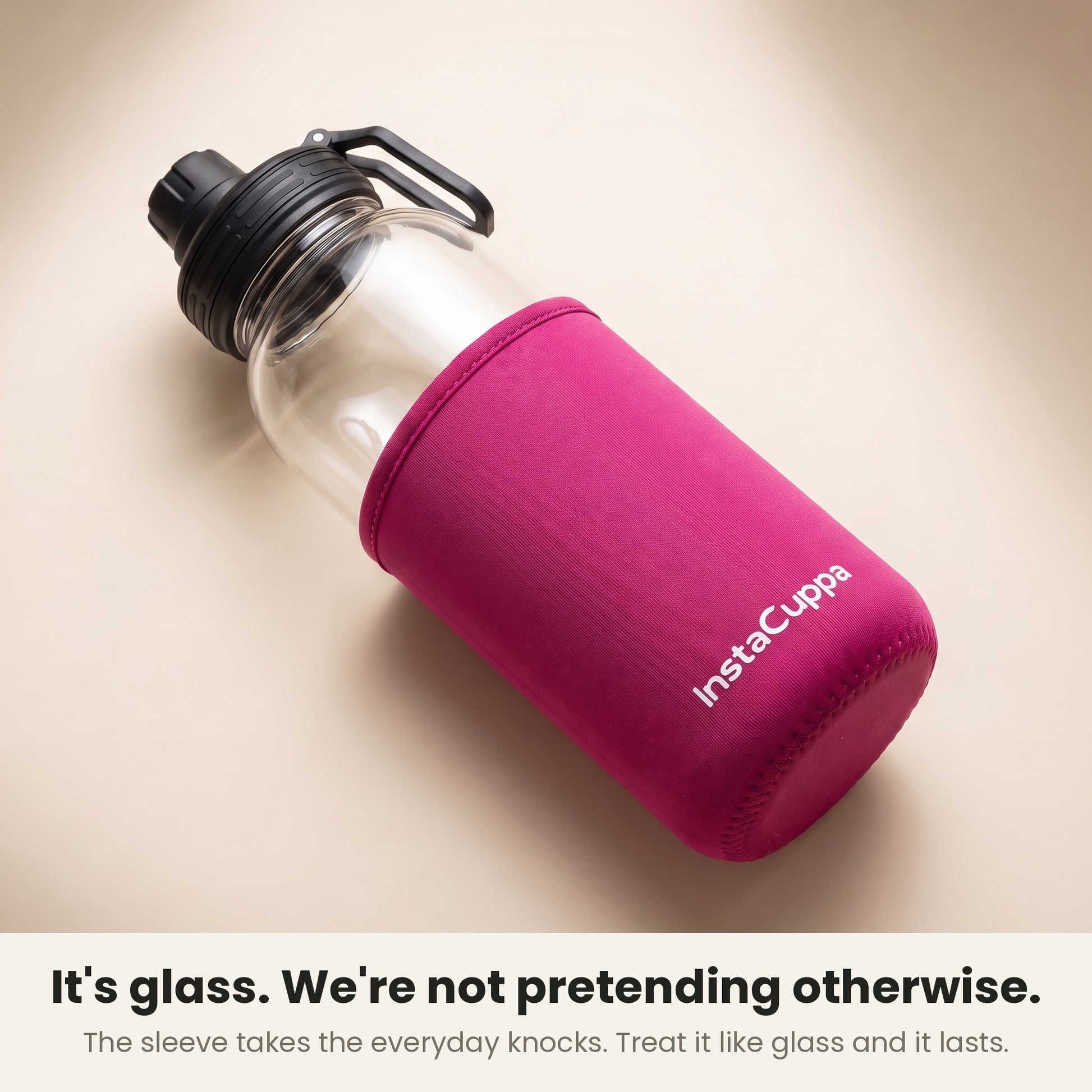 InstaCuppa Borosilicate Glass Water Bottle 1 Litre - Pink - neoprene sleeve slid down to show the glass
