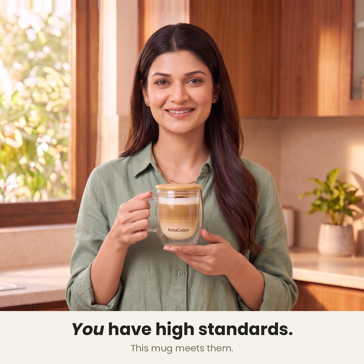 InstaCuppa Double Wall Glass Coffee Mug with Handle - woman holding the mug with bamboo lid in her kitchen – Pack of 1