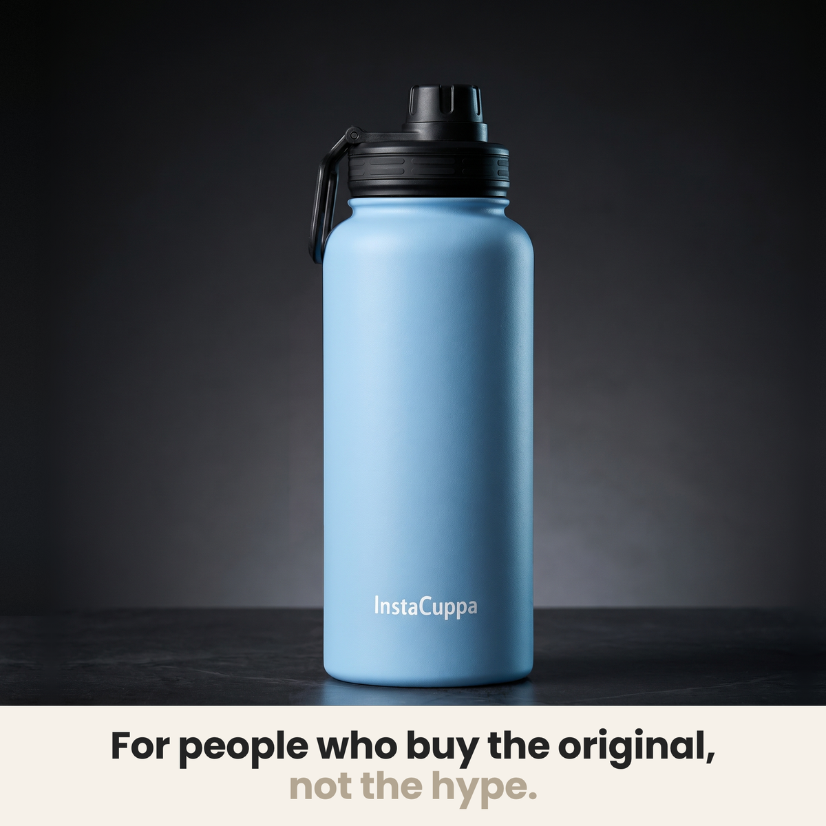InstaCuppa Insulated Water Bottle 1L (1000 ml) - Sky Blue - bottle spotlit on dark stone, caption: for people who buy the original, not the hype