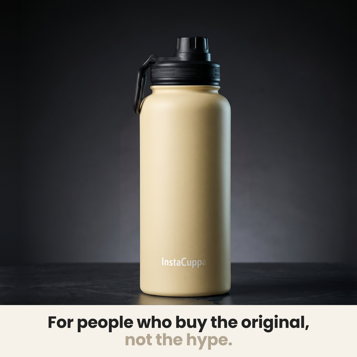 InstaCuppa Insulated Water Bottle 1L (1000 ml) - Yellow - bottle spotlit on dark stone, caption: for people who buy the original, not the hype