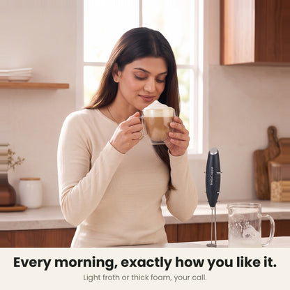 InstaCuppa Milk Frother with Stand - Black - woman enjoying a cafe-style cappuccino · 4 whisks