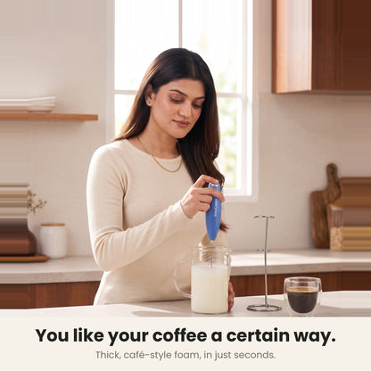 InstaCuppa Milk Frother with Stand - Blue - woman frothing milk for her coffee at home · 4 whisks