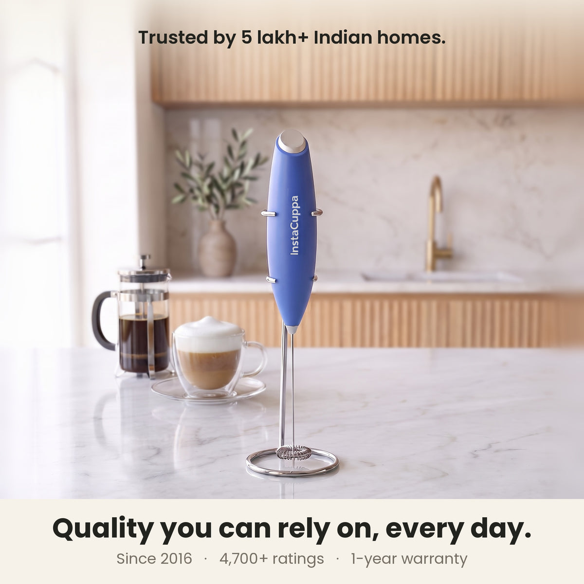 InstaCuppa Milk Frother with Stand - Blue - kitchen scene with a French press and cappuccino, trusted by coffee lovers · 4 whisks