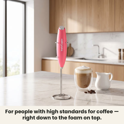 InstaCuppa Milk Frother with Stand - Pink - frother hanging on its stand in the kitchen, ready for coffee · 4 whisks