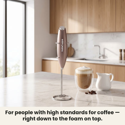 InstaCuppa Milk Frother with Stand - Rose Gold - frother hanging on its stand in the kitchen, ready for coffee · 4 whisks