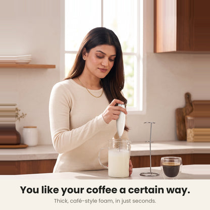 InstaCuppa Milk Frother with Stand - White - woman frothing milk for her coffee at home · 4 whisks