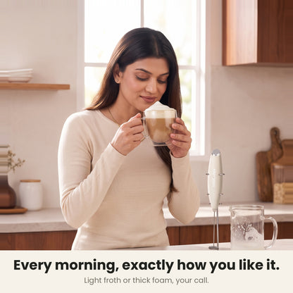 InstaCuppa Milk Frother with Stand - White - woman enjoying a cafe-style cappuccino · 4 whisks