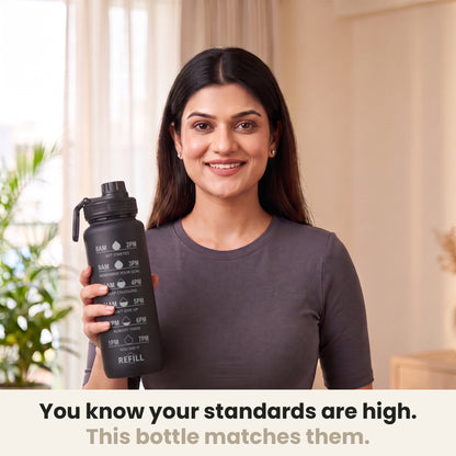 InstaCuppa Motivational Water Bottle 1 Litre - Black - woman holding the sipper bottle at home, made for high standards
