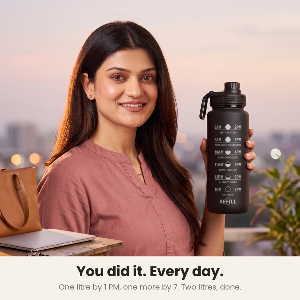 InstaCuppa Motivational Water Bottle 1 Litre - Black - woman at 7 PM with the bottle: 1 litre by 1 PM, 1 more by 7 PM