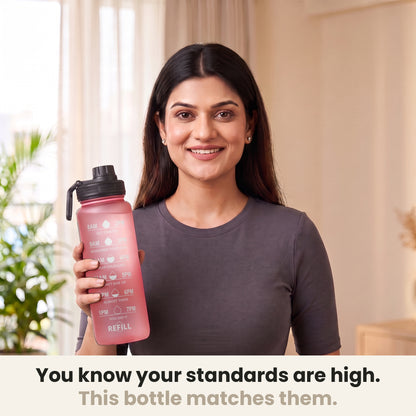 InstaCuppa Motivational Water Bottle 1 Litre - Pink - woman holding the sipper bottle at home, made for high standards