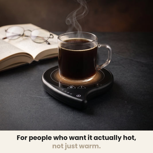 InstaCuppa coffee mug warmer for desk keeping a glass mug of coffee hot on dark stone
