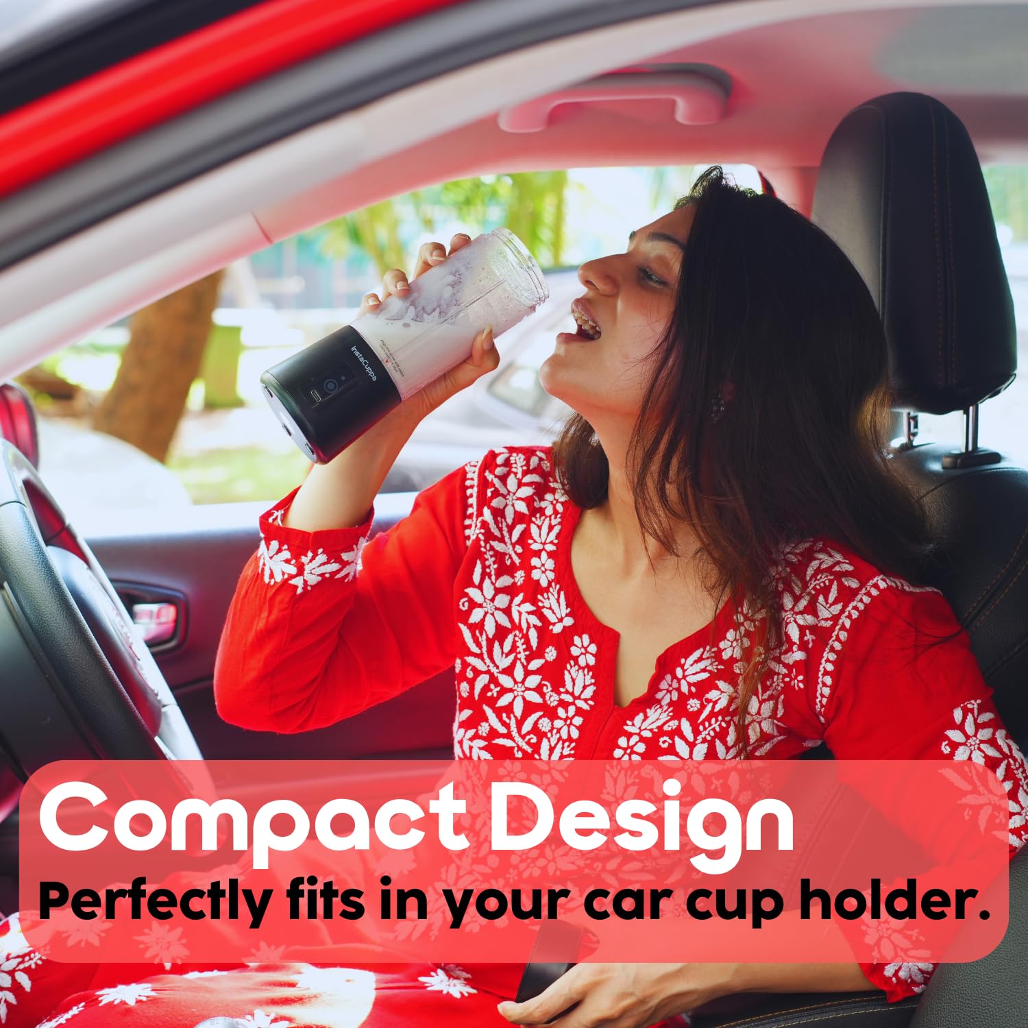 InstaCuppa Portable Blender Classic Edition used by woman in a car - compact design fits a standard car cup holder