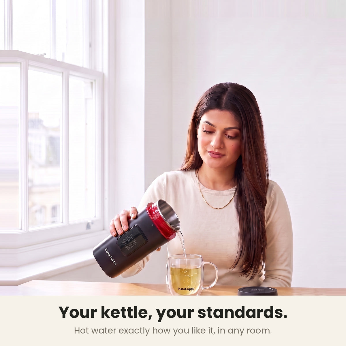 InstaCuppa Portable Electric Kettle 500 ml with Temperature Control - Black - pouring hot water into a glass mug of tea