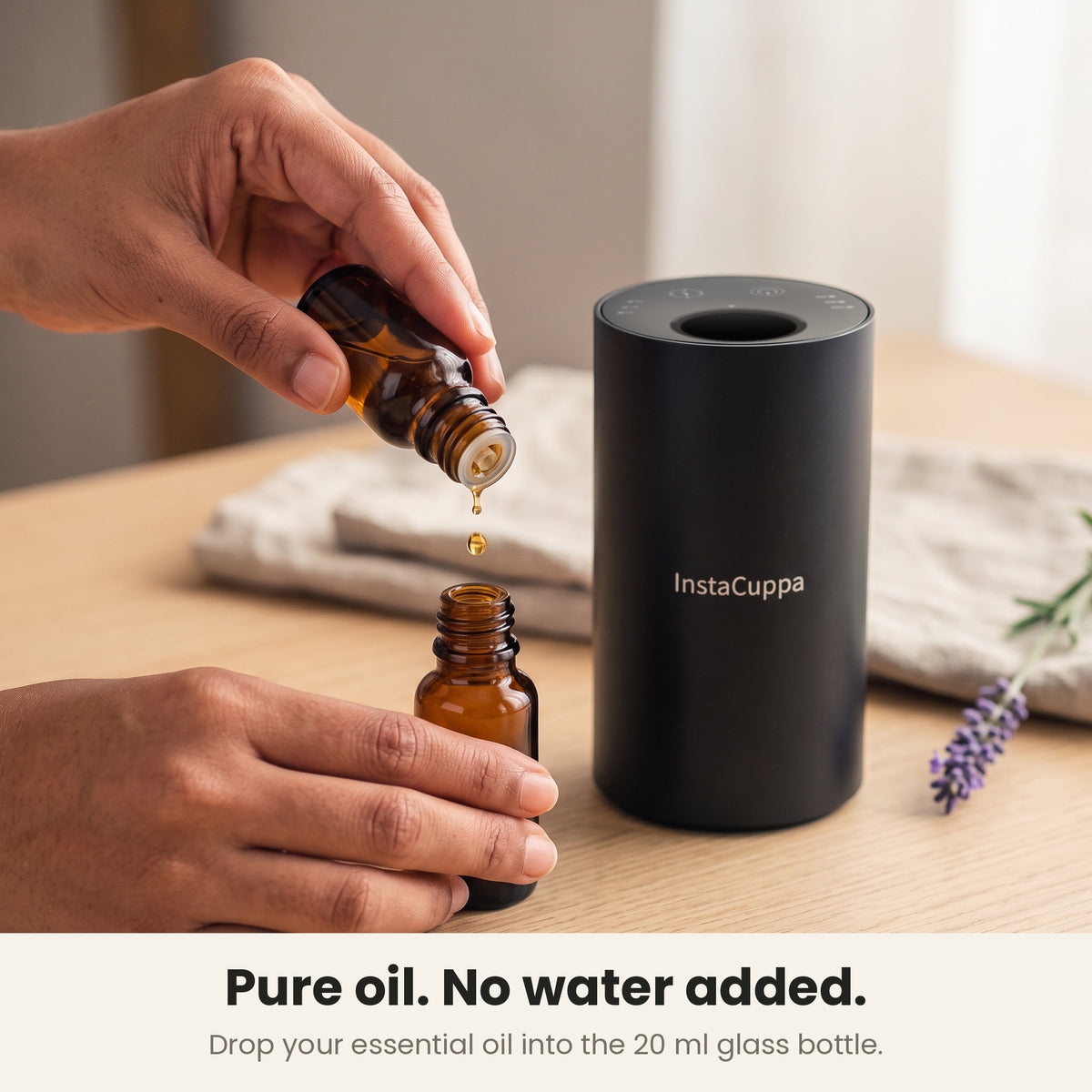 InstaCuppa Rechargeable Aroma Oil Diffuser - pure oil, no water added: essential oil dropped into the 20 ml amber glass bottle beside the diffuser