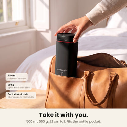 InstaCuppa Portable Electric Kettle 500 ml - Black - packed upright in the bottle pocket of a travel bag