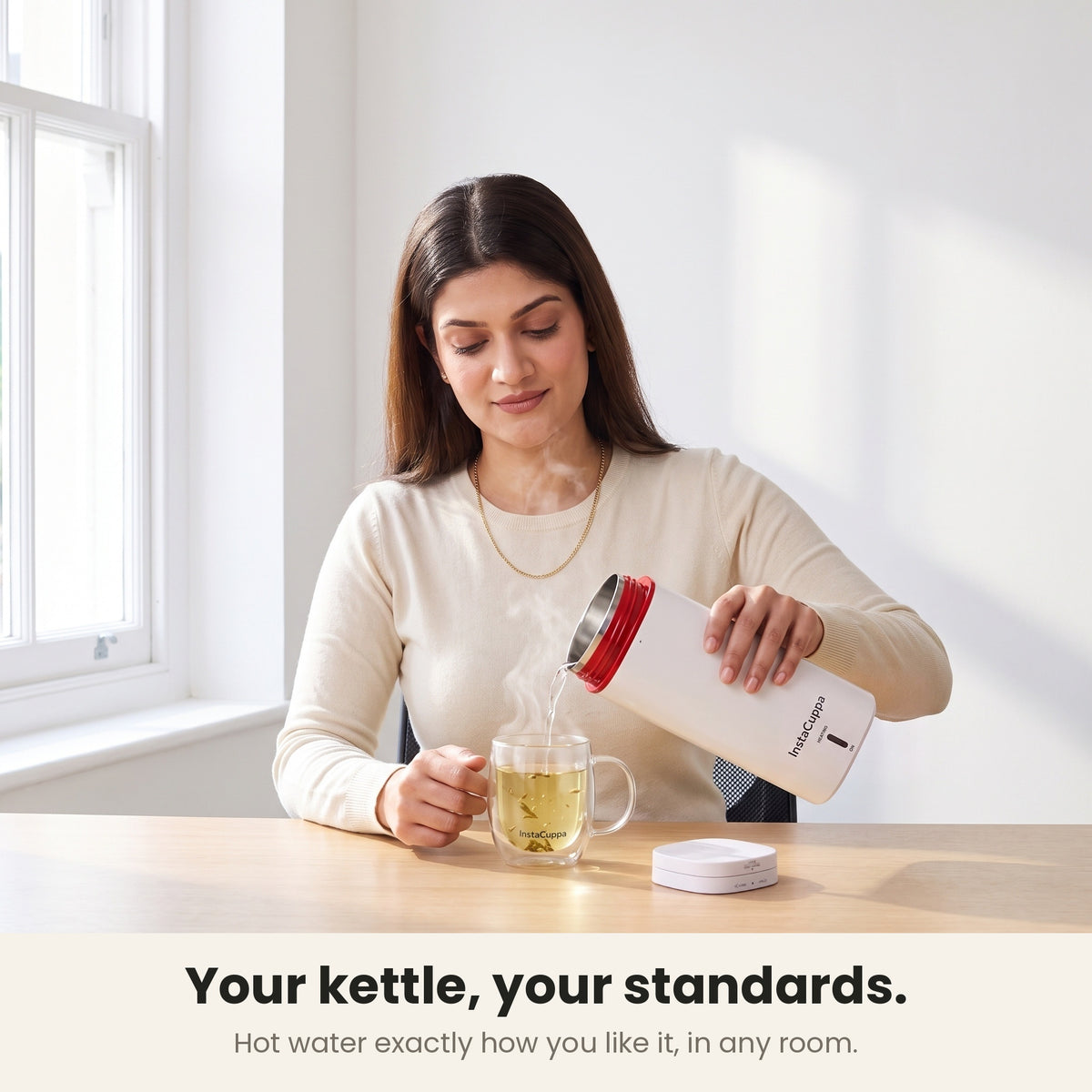 InstaCuppa Portable Electric Kettle 500 ml - White - pouring hot water into a glass mug of tea
